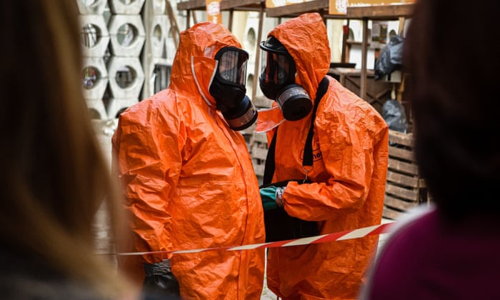 Ukrainian Emergency Ministry rescuers wear protective clothing during a nuclear emergency training session for civilians in the western Ukrainian city of Lviv on September 8, 2022 (Photo by YURIY DYACHYSHYN / AFP) (Photo by YURIY DYACHYSHYN/AFP via Getty Images)