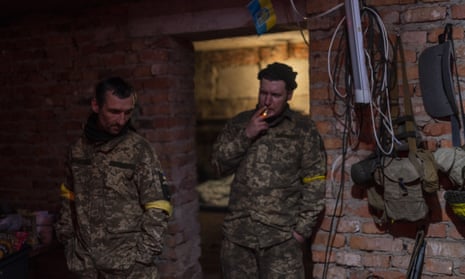 Ukrainian Territorial Defence Force members gather in a basement during a deployment break after returning from the frontline in eastern Ukraine’s Kharkiv area on Monday, May 30, 2022.