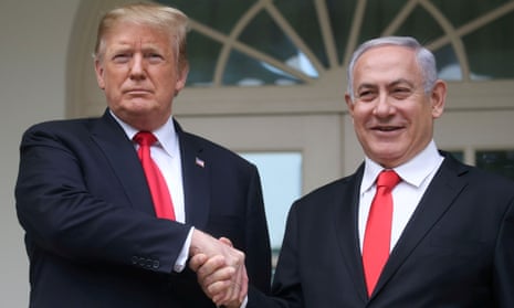 Donald Trump shakes hands with Benjamin Netanyahu at the White House in Washington DC on 25 March. 