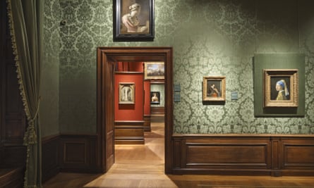 The Girl With a Pearl Earring and other paintings hanging in the Mauritshuis gallery