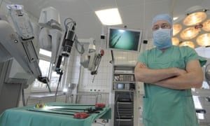 A doctor with a surgical robot at a hospital in Jena, Germany