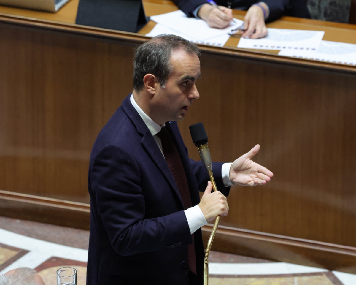 French PM Sébastien Lecornu speaks into a microphone, gesturing during a parliamentary session