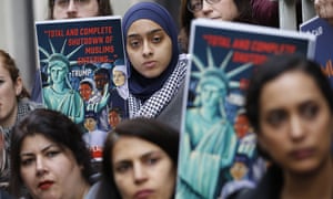 Demonstrators rally outside in Richmond, Virginia, on Wednesday where the US court of appeals will hear arguments against Donald Trump’s existing travel ban.