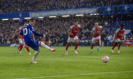 Chelsea midfielder Cole Palmer scores a penalty during the Premier League match against Arsenal.