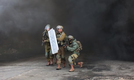 Israeli forces intervene during a protest against construction of Jewish settlements in Kafr Qaddum.