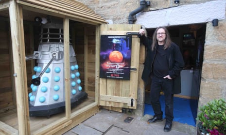 Neil Cole stands beside the Dalek shed outside his home in Allendale, Northumberland