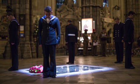 Military personnel (above and below) stand at the tomb of the Unknown Warrior during a vigil at Westminster Abbey.