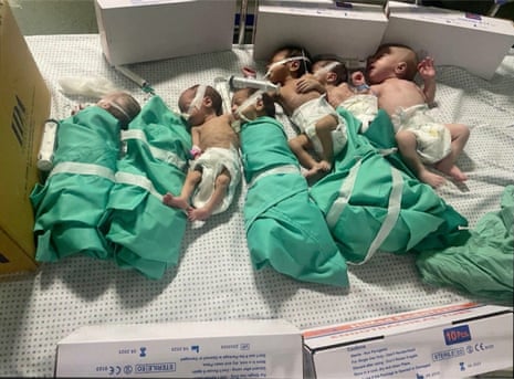 Babies lie in a hospital bed in al-Shifa.