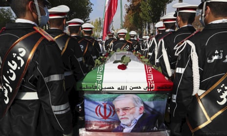 Military personnel stand near the flag-draped coffin of Mohsen Fakhrizadeh during a funeral ceremony on Monday.