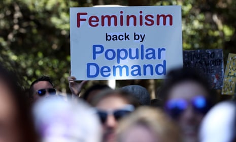 Women protestors march in a rally against US President Donald Trump following his inauguration, in Sydney on January 21, 2017.
