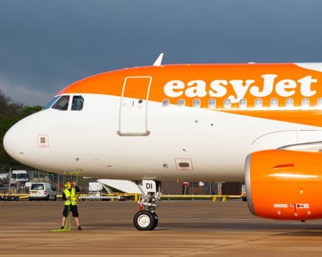 Budget airline terminal with passengers and check-in desks