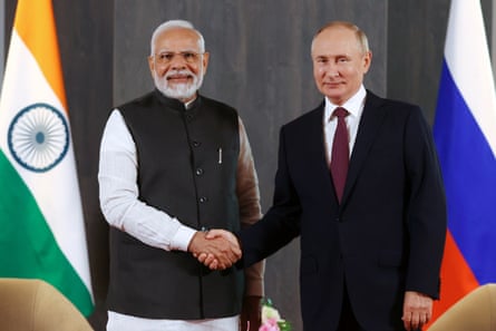 Vladimir Putin and Narendra Modi shake hands prior to their talks on the sidelines of the Shanghai cooperation Organisation (SCO) in September 2022