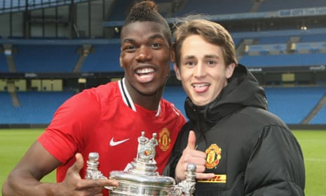 Paul Pogba and Adnan Januzaj celebrate of Manchester United winning the Manchester Senior Cup in 2012
