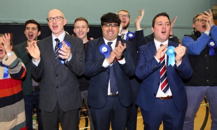 Conservative supporters celebrate victory for their candidate for Bishop Auckland, Dehenna Davison, and their Sedgefield candidate, Paul Howell, at the vote count in Spennymoor, County Durham.