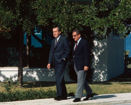 Richard Nixon walking with Henry Kissinger.