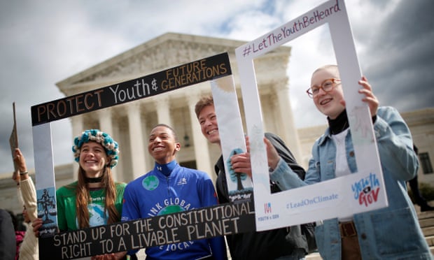 Youth protesters rally in support of a lawsuit brought on behalf of 21 youth plaintiffs against the US government over climate crisis.