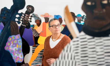 Lubaina Himid among the cutouts of slaves that form her 2004 piece Naming the Money, at Spike Island contemporary art centre in Bristol.