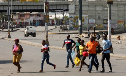 People flee gang violence, as Haiti continues in a state of emergency in Port-au-Prince on Wednesday.