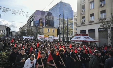 Protesters march in Athens during the 14th anniversary of the 2008 fatal police shooting of teenager Alexis Grigoropoulos.