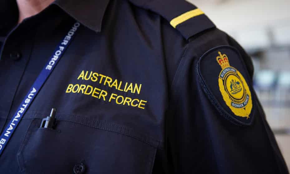 Australian Border Force personnel are seen at the airport
