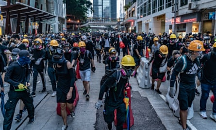 Protesters set up barricades in the Wan Chai district, one of several areas hit by violence in Hong Kong on Sunday.