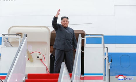 North Korea’s leader Kim Jong-un waves before departing Pyongyang to Singapore