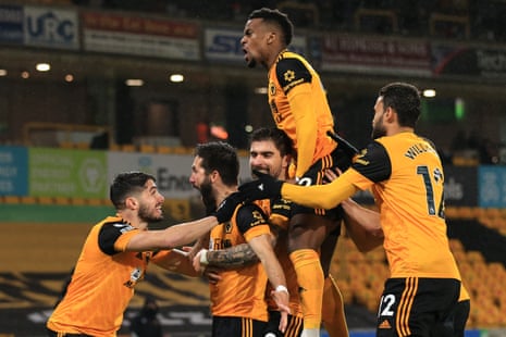 Joao Moutinho of Wolves (second left) celebrates scoring their second goal with his teammates.
