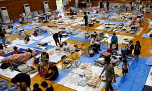 Evacuees at a school being used as a evacuation centre in Mabi, Okayama prefecture.