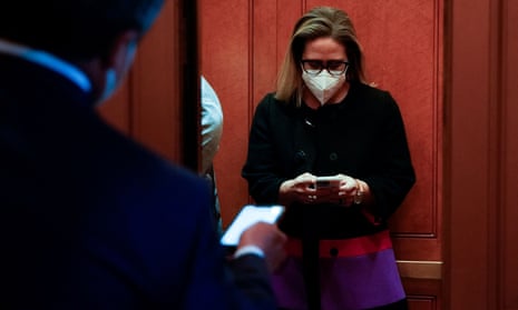 Senator Kyrsten Sinema boards an elevator at the US Capitol.