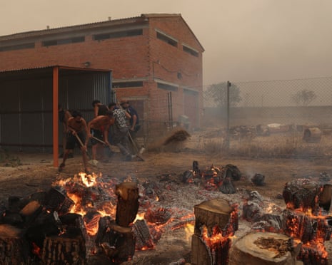 Members of the Kiat Yack Martial Arts Academy in the village of El Tiemblo, during wildfires affecting Castilla y Leon province, Spain.
