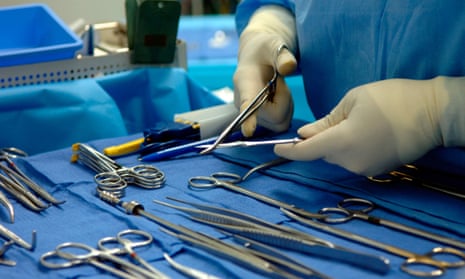 Support staff prepare surgical tools before a kidney transplant operation.