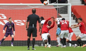 Paul Pogba (C) reacts after handling the ball and conceding a penalty.