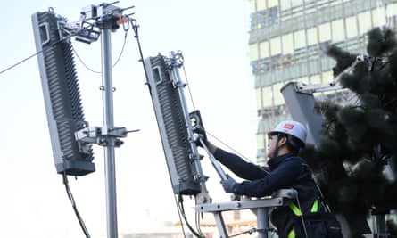 A KT technician checks an antenna for the 5G mobile network service in Seoul.