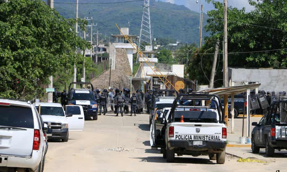 Riot police line up outside a prison after a riot broke out at the maximum security wing in Acapulco, Mexico, on 6 July. 