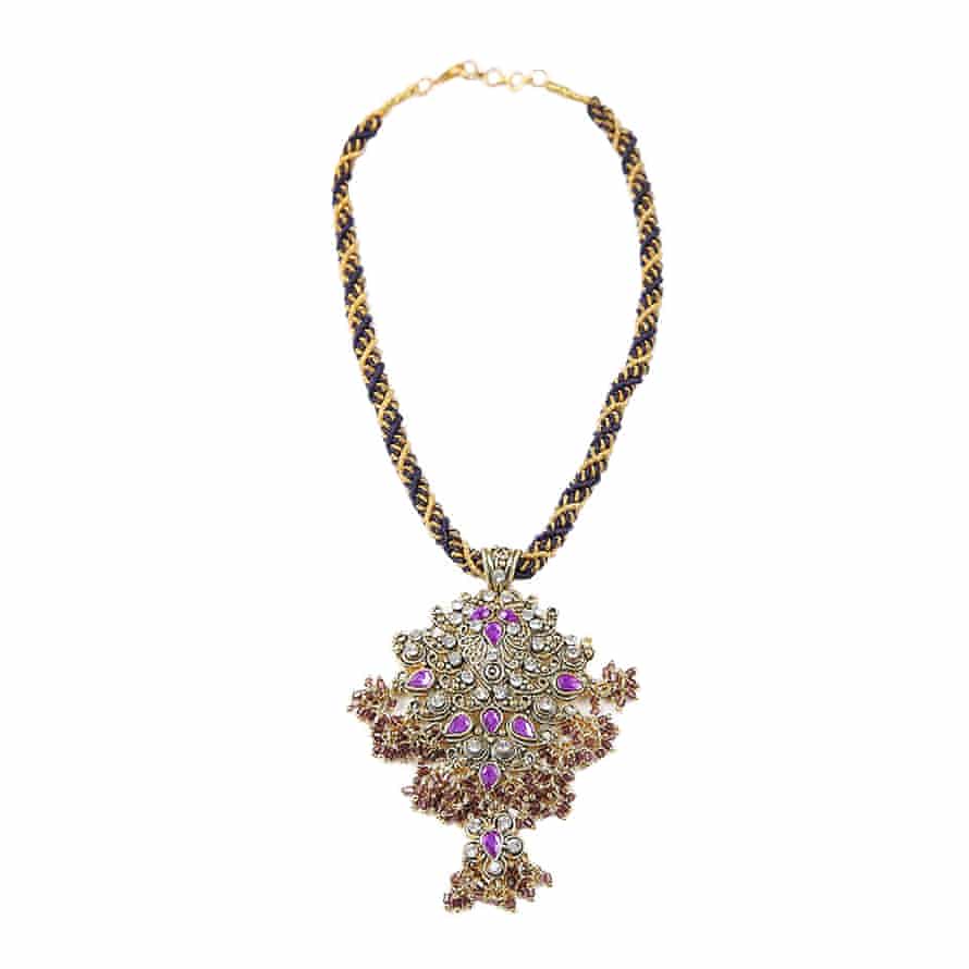 Woven with large embellished pendant