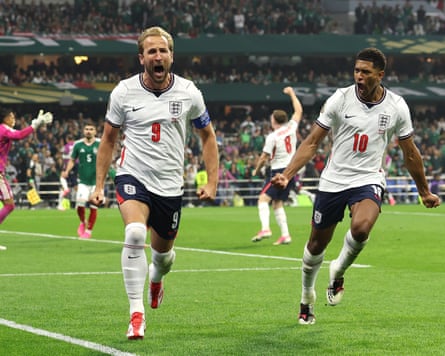 Harry Kane celebrates with Jude Bellingham after converting a penalty for his team’s third goal.
