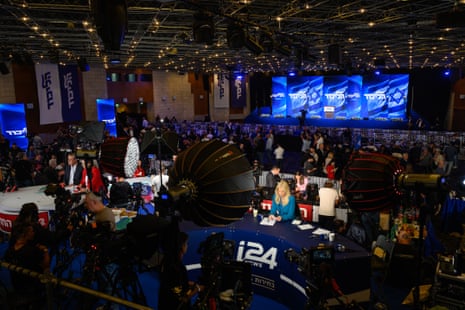 Members of the media report from the Likud party election-night event in Jerusalem.