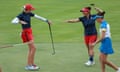 Nelly Korda (left) and her teammate Megan Khang (right) celebrates after her putt on the 14th green during Fourball Matches on Day One of the Solheim Cup.