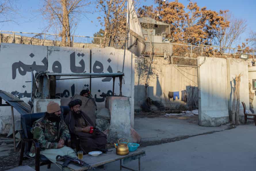Taliban guards drink tea in Kabul