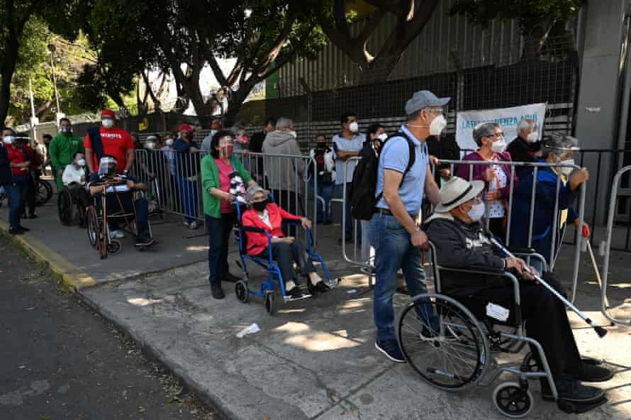 People on wheelchairs wait to receive the first dose of Russian Sputnik V vaccine against Covid-19 in Mexico City, on 26 February, 2021, as Mexico began vaccinating people over 60 years of age. On Monday, the country began the second phase of its mass vaccination plan with people over 60 now eligible for the jab. The first phase, which focused on medical personnel, lasted almost a month due to delays in the delivery of vaccine doses, AFP reports.