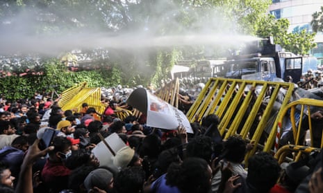 Security forces use teargas and water cannon on protesters near the president's house in Colombo on Thursday