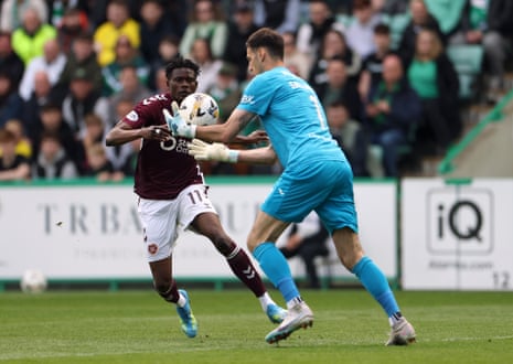 Raphael Sallinger clearly handles outside the box and is shown a red card for Hibernian
