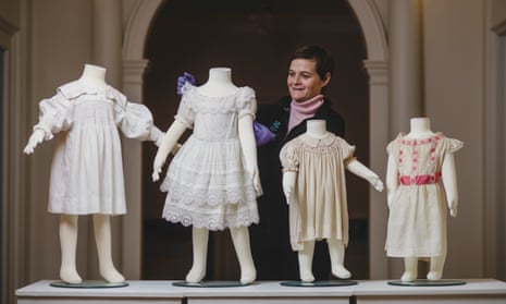 Charlotte Eddington, an assistant to Killerton’s costume curator, admires an 1860 child’s petticoat.