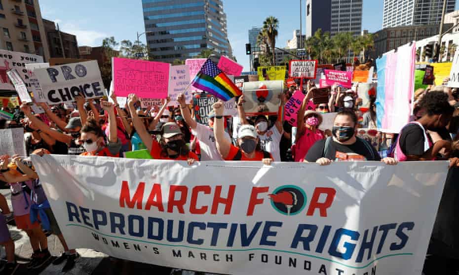 Pro-choice supporters march behind a banner reading "March for Reproductive Rights" in Los Angeles.