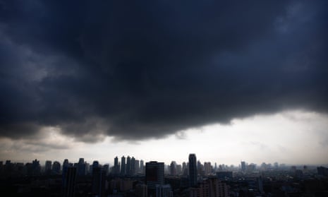 Dark clouds hover over Bangkok, yet bring no rain, on 15 August 2015
