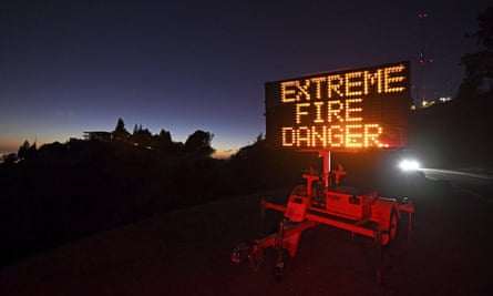 A roadside sign warns motorists of extreme fire danger on Grizzly Peak Boulevard, in Oakland, California, in October.