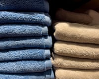 blue and tan bath towels neatly stacked