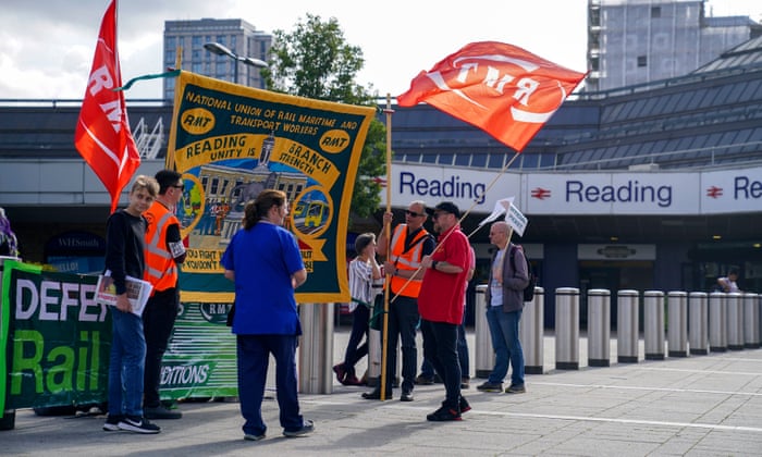 Members of the Rail, Maritime and Transport union (RMT) on the picket line outside Reading train station.