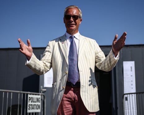 Reform UK leader Nigel Farage gestures after leaving a polling station