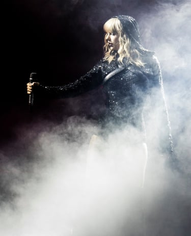 a women holding a microphone